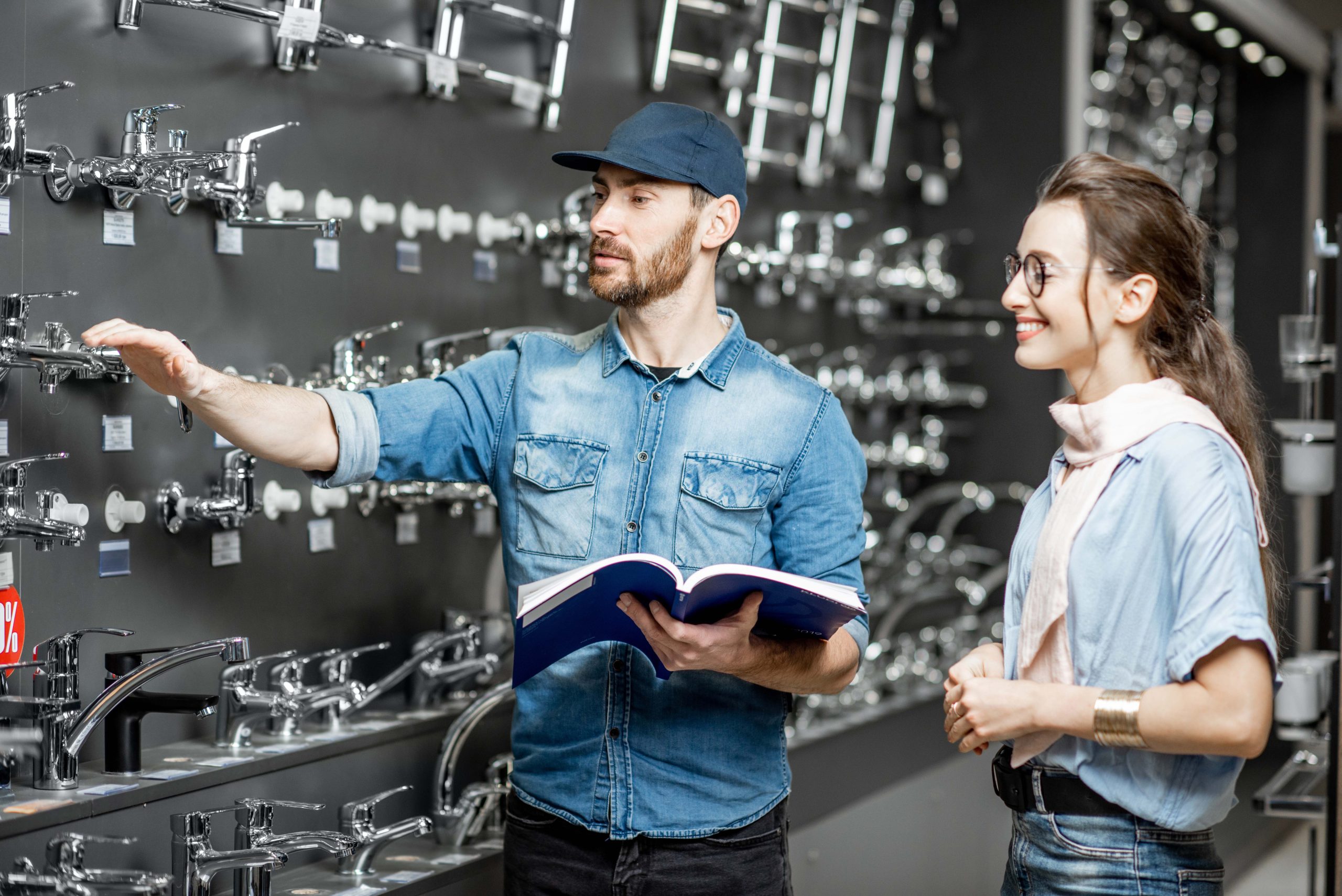 woman with salesman in the plumbing shop